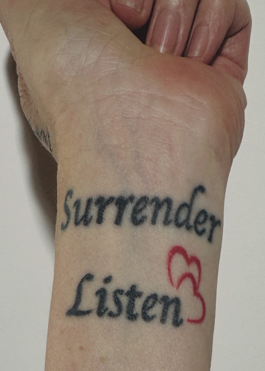 wrist tattoo surrender listen